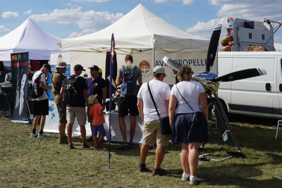 People in front of the Avia Propeller booth